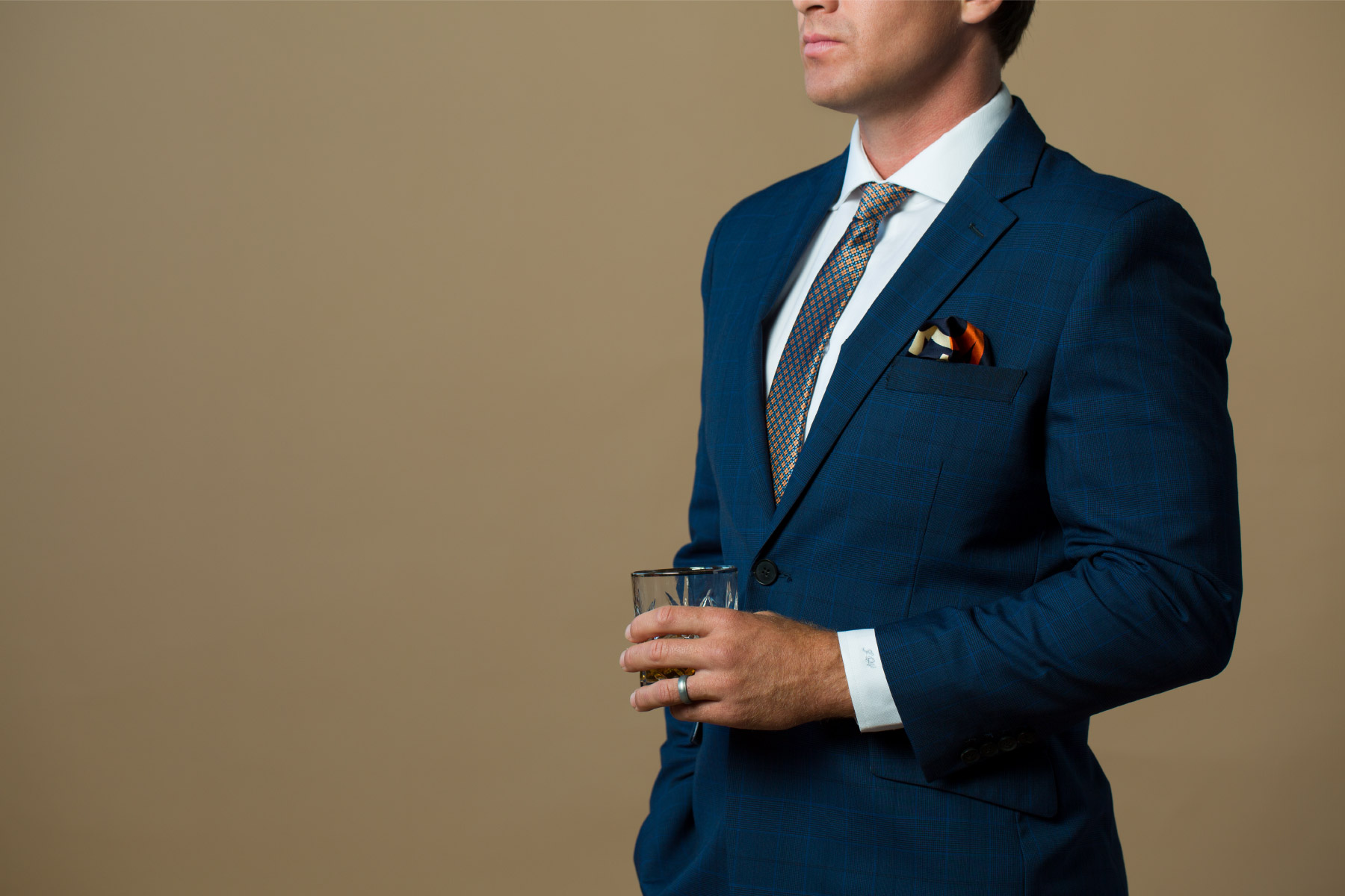 Fuze-Branding-High-Quality-Lifestyle-Product-Photography-Evolution-Of-Style-Client-Drinking-Custom-Navy-Textured-Suit