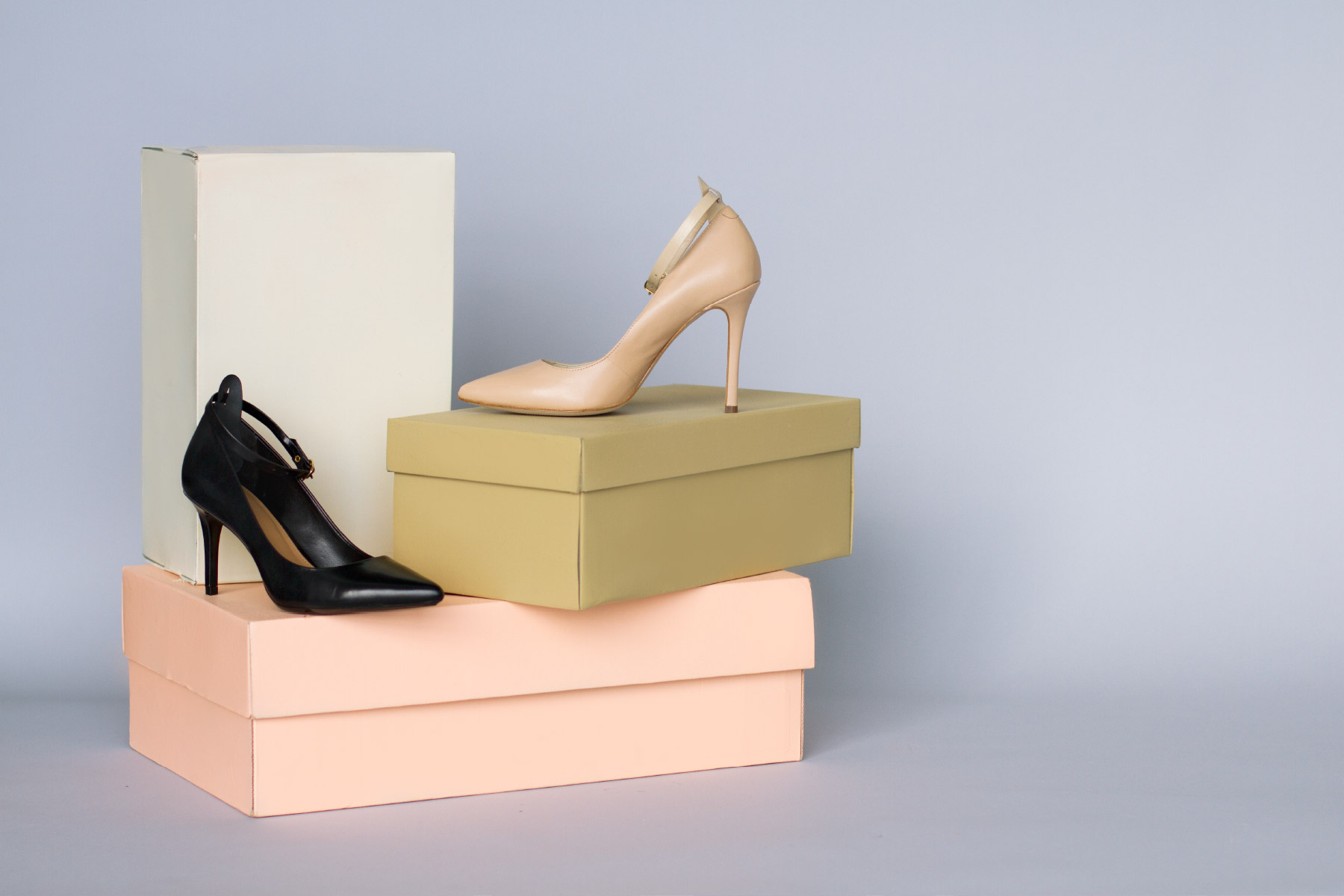 Fuze-Branding-Small-Business-Lifestyle-Product-Photography-Ginger-Straps-Fashion-Solution-Brand-Nude-Black-Heels-On-Stacked-Boxes-With-Attachable-Ankle-Straps