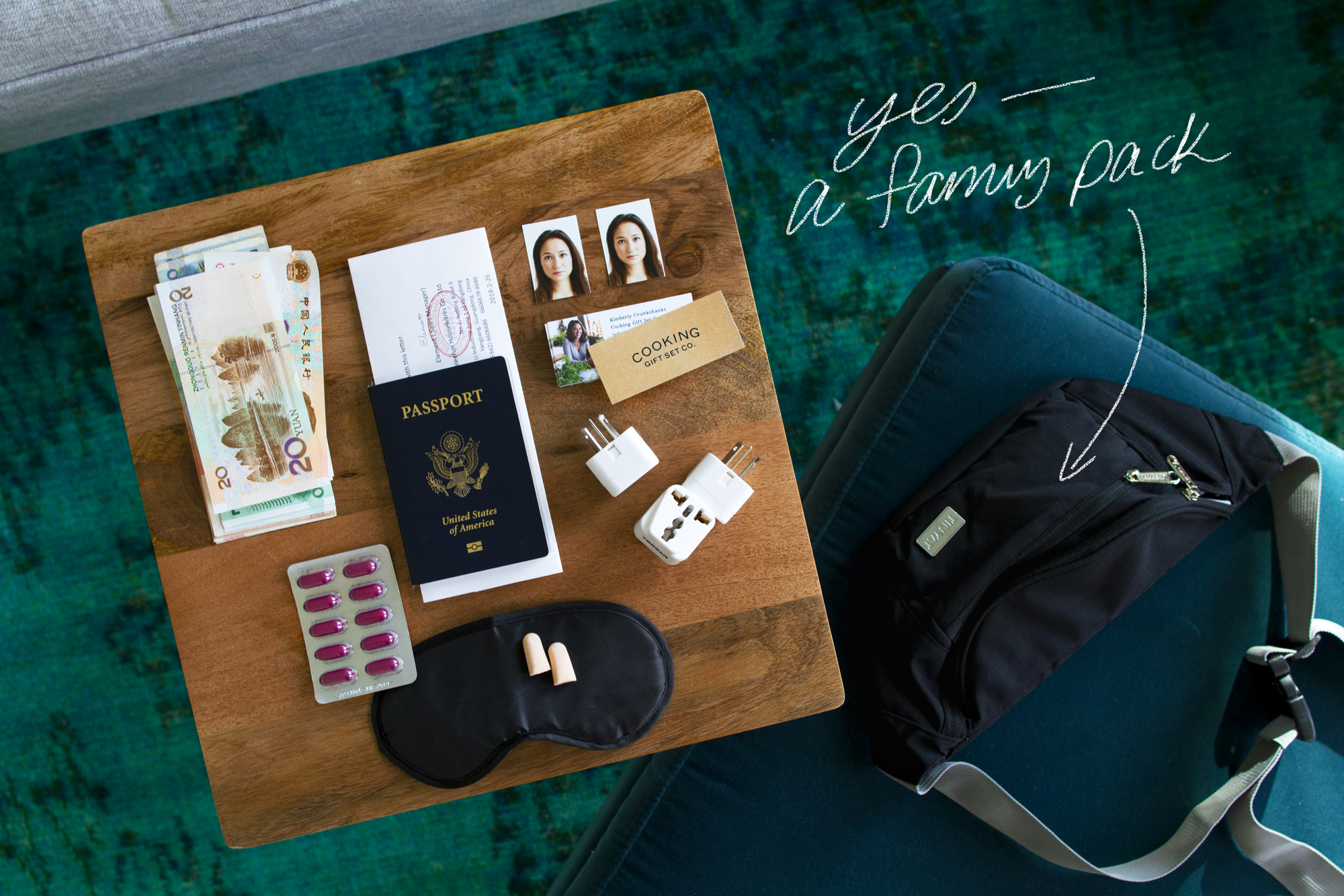 Flat lay image of international business travel essentials for the China Canton Fair for product sourcing and vendor networking. Sleep mask. Ear plugs. Visa photos.