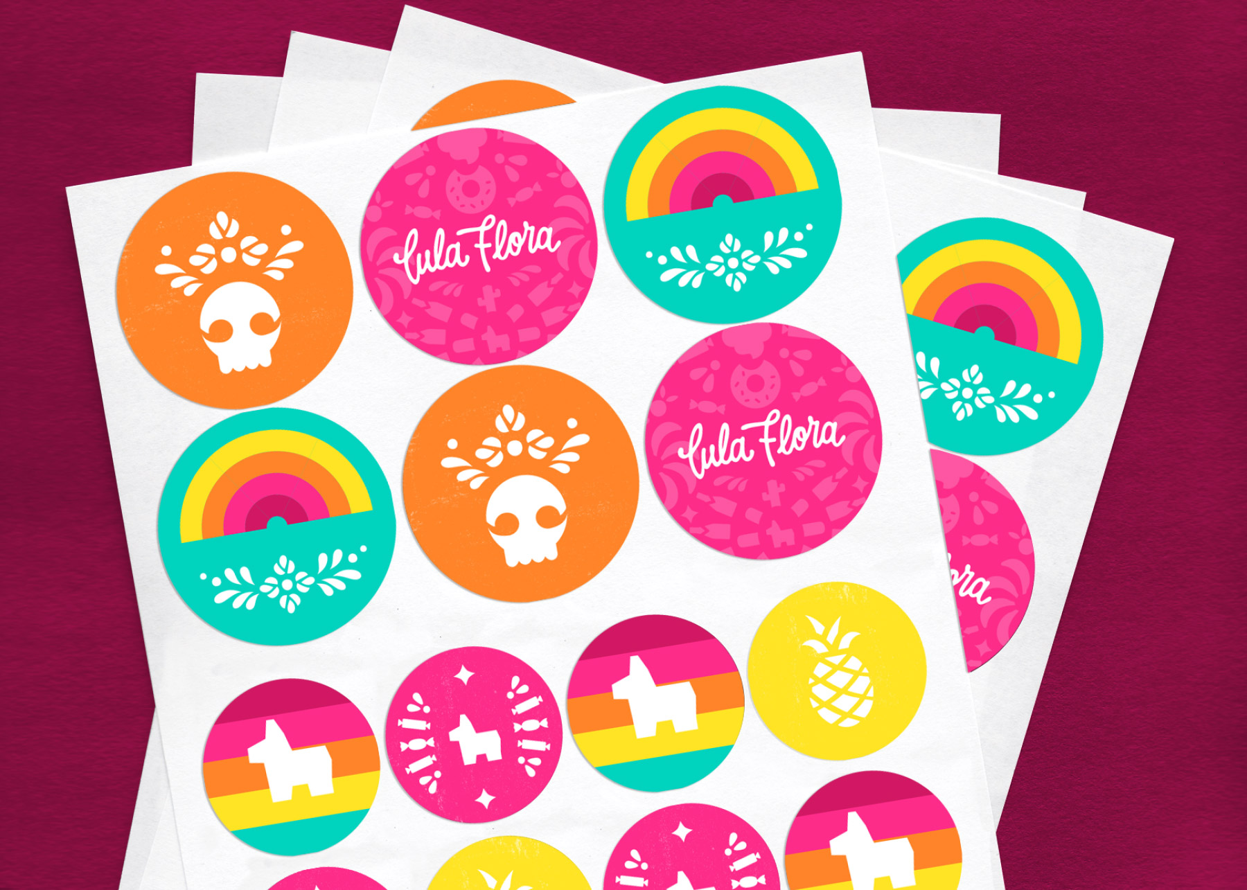 Packaging stickers with icons of candy, piñatas, and other fiesta elements