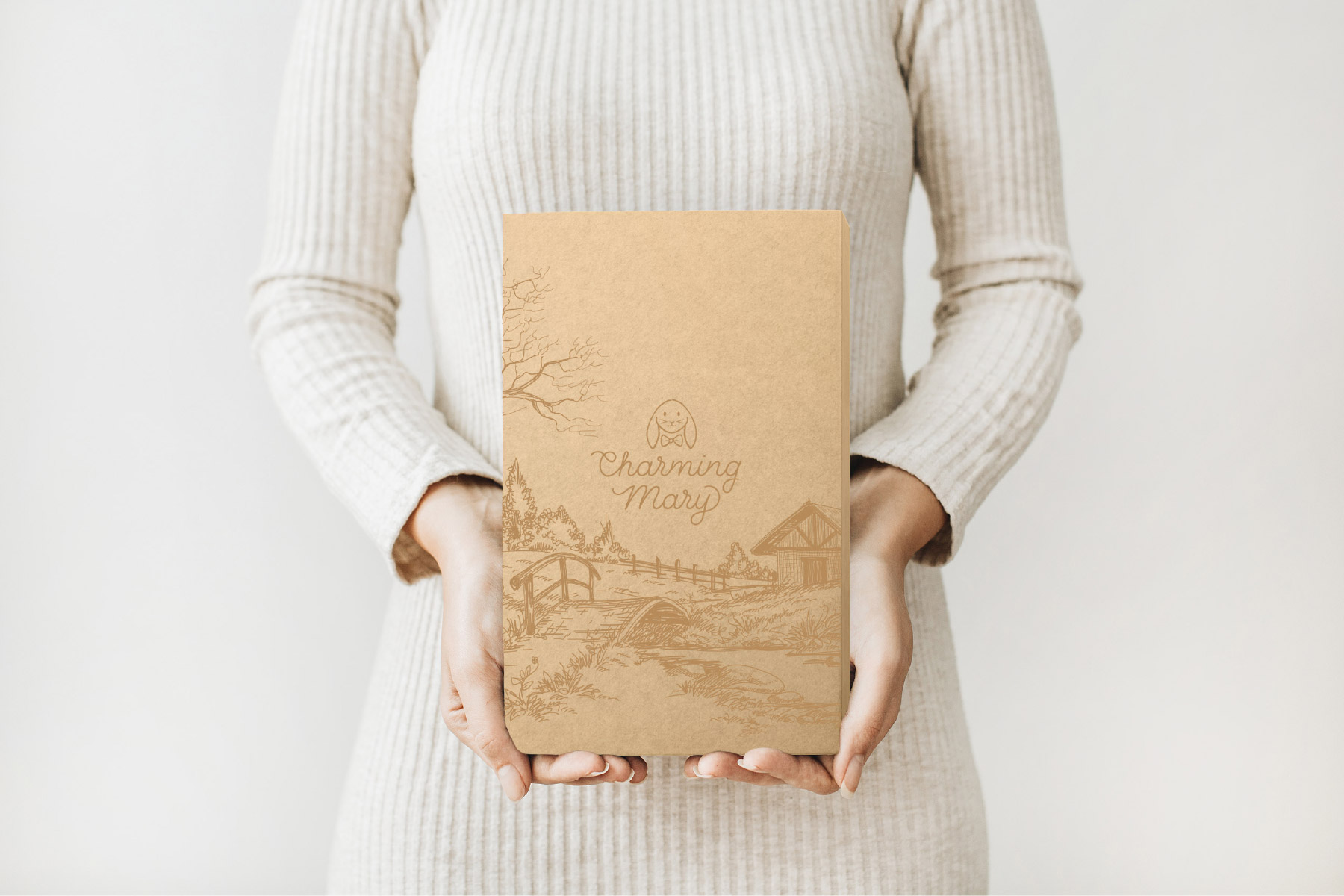 Kraft shipping box with storybook inspired forest scene and logo