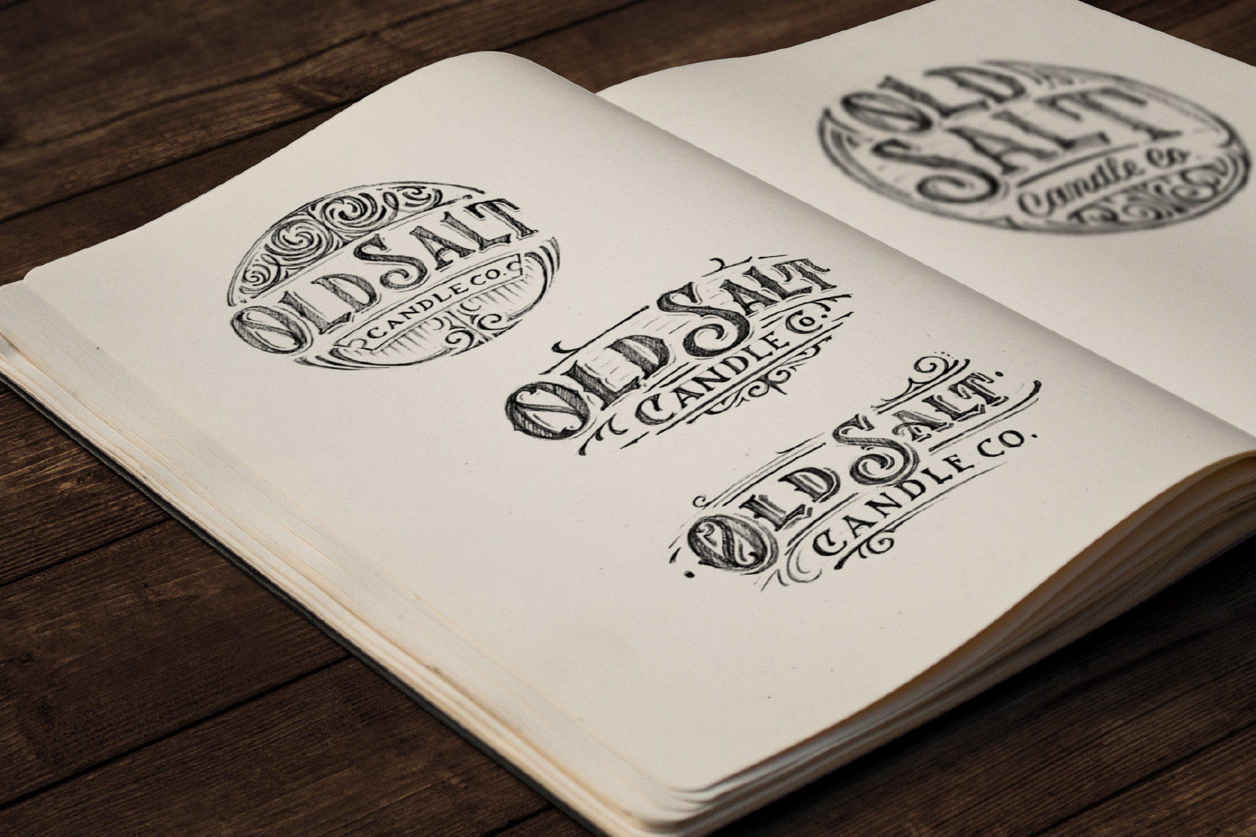 Victorian logos sketches in notebook