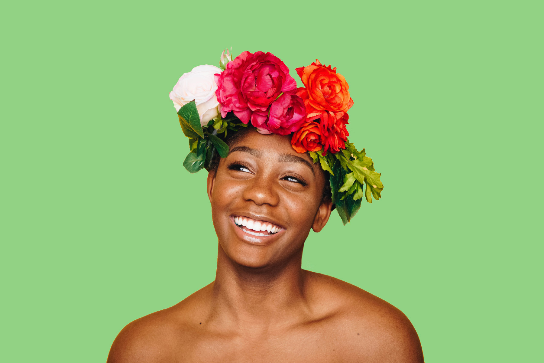 Young woman with clear natural skin wearing a flower crown