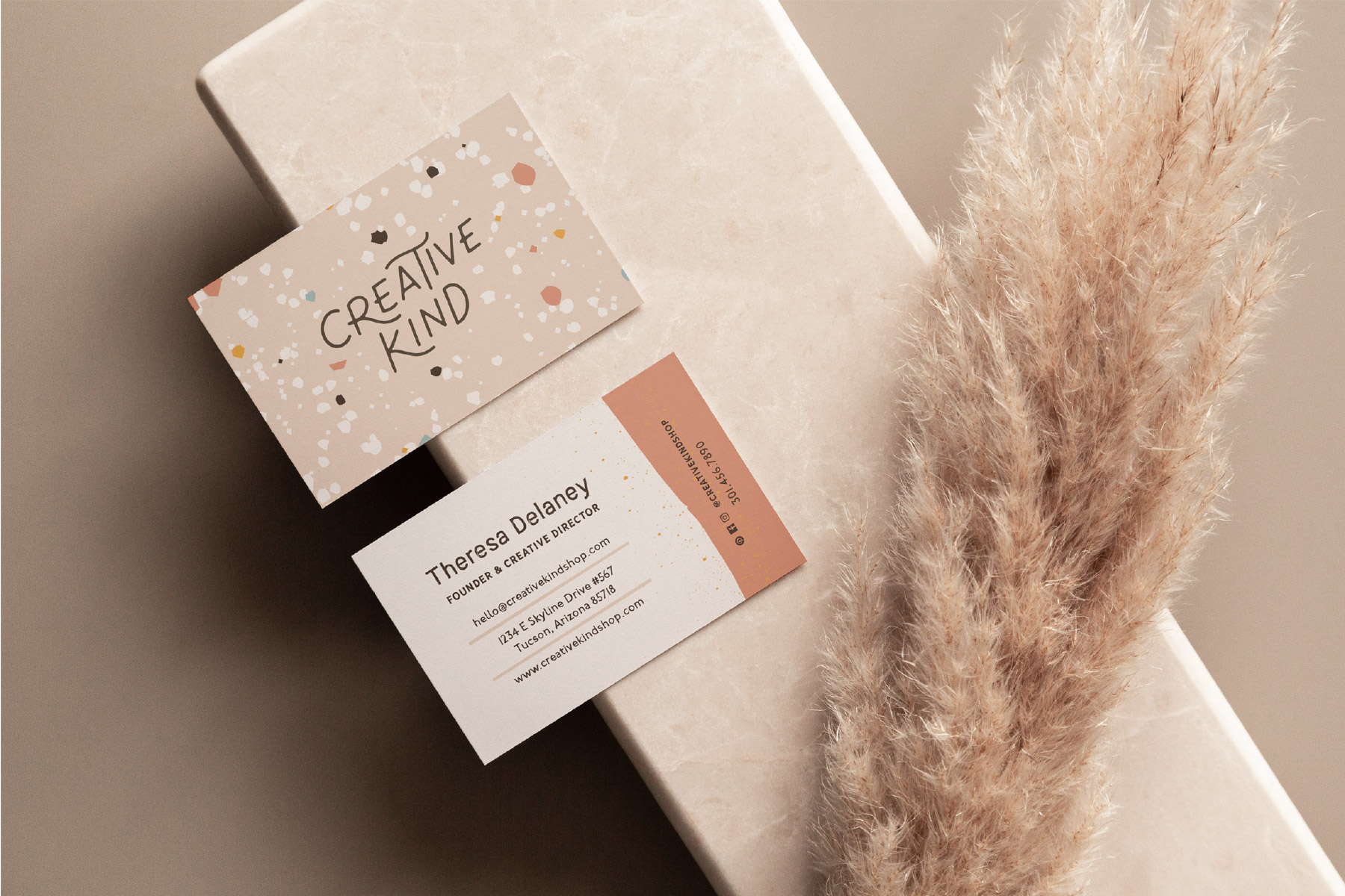 Terrazzo textured business card with layered paper elements